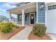 Inviting front porch with decorative columns and a charming entrance at 1409 Augustus Beamon Dr, Indian Trail, NC 28079