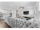 Spacious living room with grey sectional, modern decor, hardwood floors, and a TV at 1409 Augustus Beamon Dr, Indian Trail, NC 28079