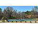 Community tennis courts with lush greenery, providing a recreational space for residents at 1409 Augustus Beamon Dr, Indian Trail, NC 28079