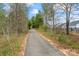 Picturesque walking trail winding through a natural setting, perfect for outdoor activities at 1409 Augustus Beamon Dr, Indian Trail, NC 28079