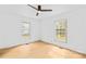 Bright bedroom with two windows and ceiling fan, offering a serene retreat at 1409 Effingham Rd, Charlotte, NC 28208