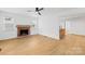 Comfortable living room featuring a fireplace, offering a cozy space for relaxation and gatherings at 1409 Effingham Rd, Charlotte, NC 28208