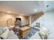 Cozy basement area with plush seating, decorative pillows, and a fun relaxed ambiance near the stairs at 1529 S Wendover Rd, Charlotte, NC 28211