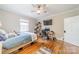 Bedroom featuring a ceiling fan, hardwood floors, and a workstation with modern computer at 1529 S Wendover Rd, Charlotte, NC 28211