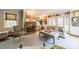 Inviting living room with stone fireplace, built-in bookshelves, and ample natural light at 1529 S Wendover Rd, Charlotte, NC 28211