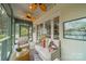 Cozy screened-in porch with outdoor seating and a ceiling fan, perfect for relaxing at 1529 S Wendover Rd, Charlotte, NC 28211