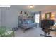 This bedroom has carpeted floors, a bunk bed, and a large window at 158 Ventor Way, Mooresville, NC 28115