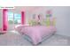 Bright bedroom featuring two twin beds with decorative pillows and large windows at 158 Ventor Way, Mooresville, NC 28115