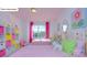 Bright bedroom featuring two twin beds with decorative pillows and large windows at 158 Ventor Way, Mooresville, NC 28115