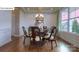 Formal dining room with hardwood floors, chandelier, and large window at 158 Ventor Way, Mooresville, NC 28115