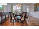 Formal dining room with hardwood floors, stylish lighting, and elegant decor at 158 Ventor Way, Mooresville, NC 28115