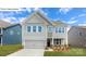 Charming two-story home with a two-car garage and well-maintained landscaping at 158 Ventor Way, Mooresville, NC 28115