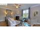 Bright living room with fireplace, neutral tones, and comfortable seating at 158 Ventor Way, Mooresville, NC 28115