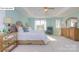 Airy main bedroom with calming colors, large windows, and elegant furnishings creating a relaxing retreat at 158 Ventor Way, Mooresville, NC 28115