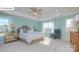 Serene main bedroom with tray ceilings, soft colors, and ample natural light from large windows at 158 Ventor Way, Mooresville, NC 28115