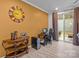 Bright home office with a desk setup, sliding glass doors, and ample natural light at 16038 Red Buckeye Ln, Huntersville, NC 28078