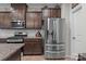 Well-equipped kitchen with stainless steel refrigerator, stylish cabinets, and modern appliances at 16038 Red Buckeye Ln, Huntersville, NC 28078