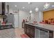 Spacious kitchen featuring granite countertops, stainless steel appliances, and an island with bar seating at 16038 Red Buckeye Ln, Huntersville, NC 28078