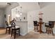 Finished basement with bar area perfect for entertaining, complete with bar and table with chairs at 16614 Ruby Hill Pl, Charlotte, NC 28278