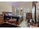 Cozy bedroom with neutral walls, a bed, and plenty of natural light streaming through the windows at 16614 Ruby Hill Pl, Charlotte, NC 28278