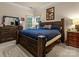 A spacious bedroom with a large bed, windows, and an adjacent dresser, offering ample storage at 16614 Ruby Hill Pl, Charlotte, NC 28278