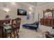 Bedroom featuring a decorative dresser, television, and a comfortable chaise lounge at 16614 Ruby Hill Pl, Charlotte, NC 28278