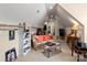 Finished attic with a comfortable sofa, desk area, and ample storage space at 16614 Ruby Hill Pl, Charlotte, NC 28278