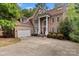 Beautiful brick home offers mature landscaping and a welcoming entrance at 16614 Ruby Hill Pl, Charlotte, NC 28278