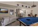 Finished basement with a pool table and bar area great for hosting at 16614 Ruby Hill Pl, Charlotte, NC 28278