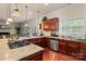 This kitchen features an island with a gas cooktop and granite countertops and stainless steel appliances at 16614 Ruby Hill Pl, Charlotte, NC 28278