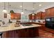 Spacious kitchen with a center island, granite countertops, and modern appliances at 16614 Ruby Hill Pl, Charlotte, NC 28278