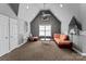 A stylish living room features vaulted ceilings, plush carpeting, and ample seating at 16614 Ruby Hill Pl, Charlotte, NC 28278