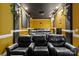 Dedicated home theater room features tiered seating and professional projection equipment at 16614 Ruby Hill Pl, Charlotte, NC 28278