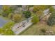 Light rail car arriving at station surrounded by lush trees in an aerial photograph at 1933 W Trade St, Charlotte, NC 28216