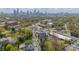 An aerial view showcases the cityscape, trees, and houses in a harmonious, bustling urban landscape at 1933 W Trade St, Charlotte, NC 28216