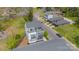 An aerial view of a modern townhome with a gray roof, balconies, and sleek design in a residential area at 1933 W Trade St, Charlotte, NC 28216