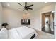 Neutral bedroom with ceiling fan features a large television at 1933 W Trade St, Charlotte, NC 28216