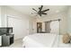 Bright bedroom with a ceiling fan, neutral carpet and primary bed at 1933 W Trade St, Charlotte, NC 28216