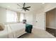 Bright bedroom with a ceiling fan, neutral carpet and primary bed at 1933 W Trade St, Charlotte, NC 28216