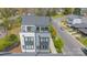 An elevated view highlights a modern residence featuring a roof terrace, seamlessly blending urban style at 1933 W Trade St, Charlotte, NC 28216