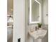 Modern powder room with vessel sink, lit mirror and neutral walls at 1933 W Trade St, Charlotte, NC 28216