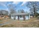 Charming single-story home with freshly painted exterior and well-manicured front lawn at 200 W Shannonhouse St, Shelby, NC 28152