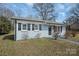 Charming single-story home with freshly painted exterior and well-manicured front lawn at 200 W Shannonhouse St, Shelby, NC 28152