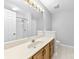 A well-lit bathroom featuring a shower/tub combo and vanity with a mirror and cabinet at 2124 Marquesas Ave, Tega Cay, SC 29708