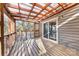A covered wooden deck area, offering a secluded spot to enjoy the outdoors at 2124 Marquesas Ave, Tega Cay, SC 29708