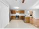 Kitchen with wood cabinets, stainless steel appliances, and adjoining breakfast nook at 2124 Marquesas Ave, Tega Cay, SC 29708