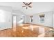 Bright living room featuring hardwood floors, white walls, and large windows at 2124 Marquesas Ave, Tega Cay, SC 29708