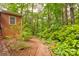 Lush backyard area featuring a stone path and a variety of green plants at 235 John Rainey Rd, Salisbury, NC 28147
