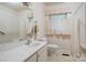 Bathroom featuring neutral accents, a shower-tub combination, and a large vanity at 235 John Rainey Rd, Salisbury, NC 28147