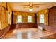 Bright bedroom with brick accent wall, wood floors, and multiple windows at 235 John Rainey Rd, Salisbury, NC 28147
